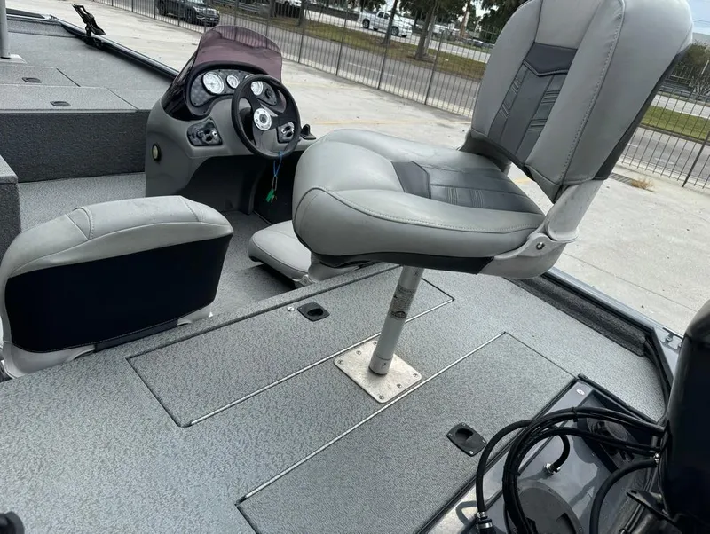 Slide: The Image of 2018 Tracker Pro 170 boat interior with steering console and seating. - 10