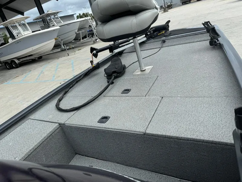 Slide: The Image of 2018 Tracker Pro 170 boat interior with seating and storage compartments. - 14