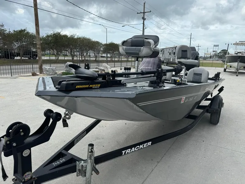 Slide: The Image of 2018 Tracker Pro 170 fishing boat on trailer, gray color, outdoor setting. - 3