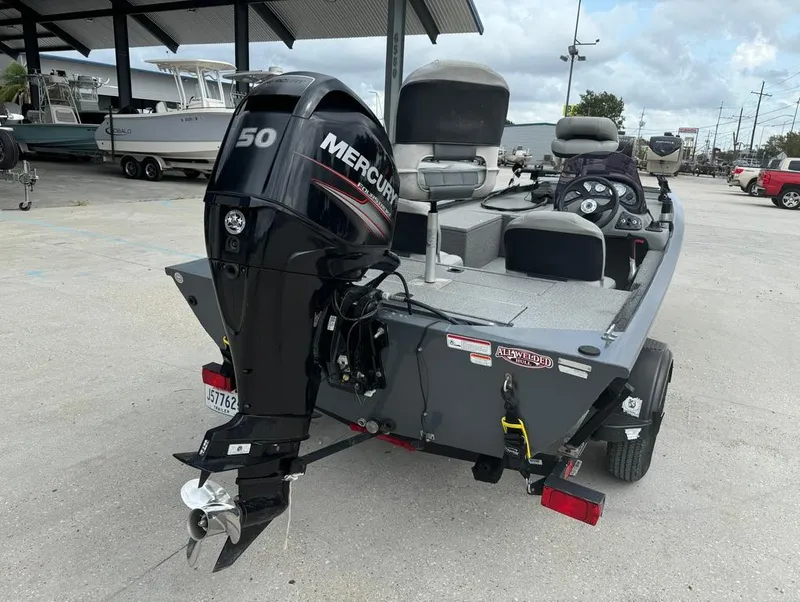 Slide: The Image of 2018 Tracker Pro 170 boat with Mercury 50 HP engine in a marina. - 7
