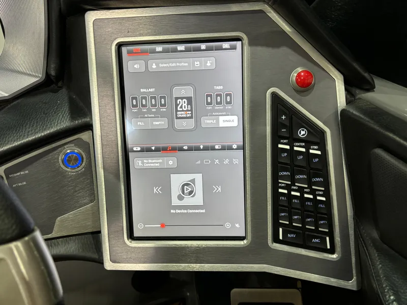 Slide: The Image of 2023 MasterCraft X24 dashboard with touchscreen controls and navigation system. - 13