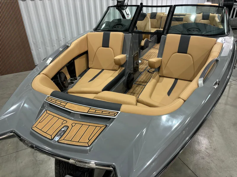 Slide: The Image of 2023 MasterCraft X24 boat with tan and gray interior, sleek design. - 5