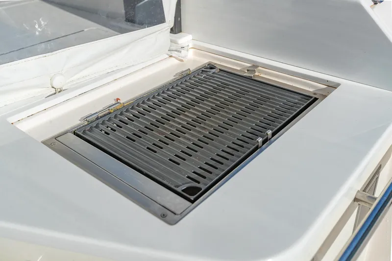 Slide: The Image of Outdoor grill on 2021 Regal 36 Grande Coupe yacht deck. - 18