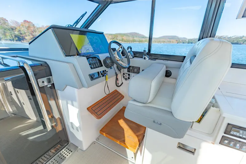 Slide: The Image of Interior cockpit of 2021 Regal 36 Grande Coupe with modern controls and seating. - 19