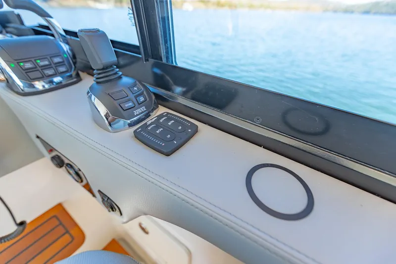Slide: The Image of Control panel of 2021 Regal 36 Grande Coupe overlooking water. - 22