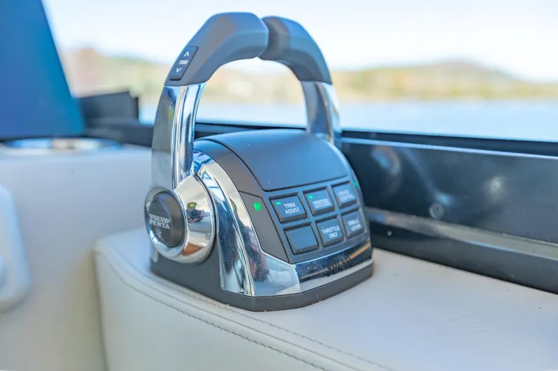 Slide: The Image of Throttle control of 2021 Regal 36 Grande Coupe boat, featuring sleek design and modern technology. - 23
