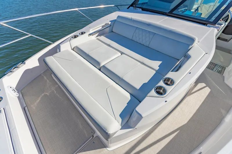 Slide: The Image of Luxurious seating on 2021 Regal 36 Grande Coupe yacht, featuring sleek design and comfortable cushions. - 26