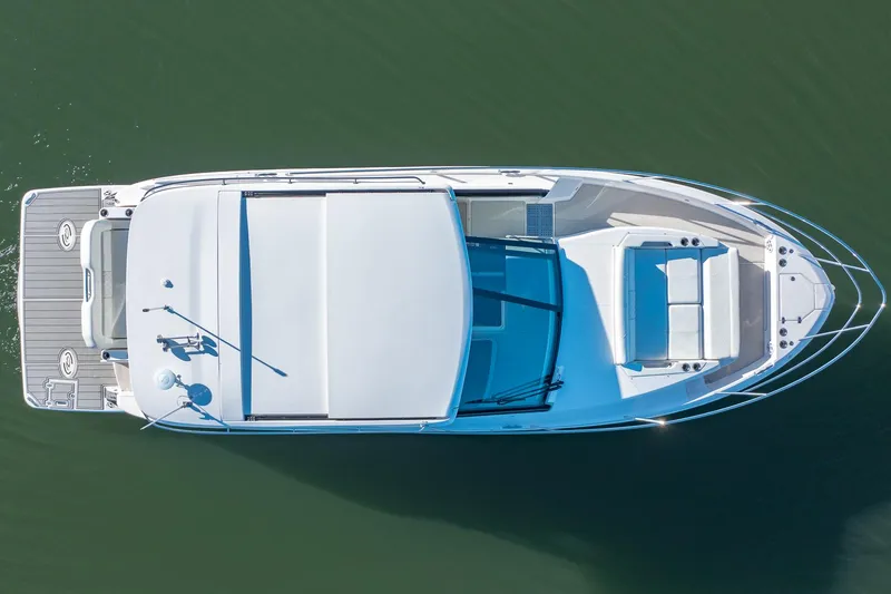 Slide: The Image of Aerial view of 2021 Regal 36 Grande Coupe yacht on calm water. - 5