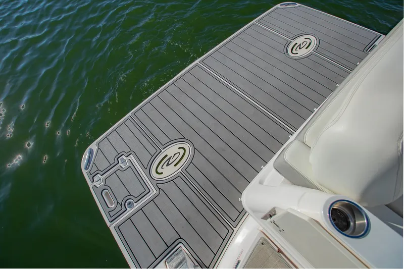 Slide: The Image of 2021 Regal 36 Grande Coupe swim platform on calm water. - 8