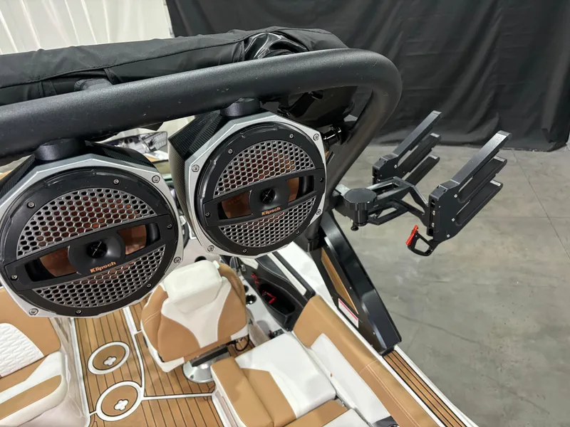 Slide: The Image of 2024 MasterCraft X24 boat interior with speakers and wakeboard rack. - 11
