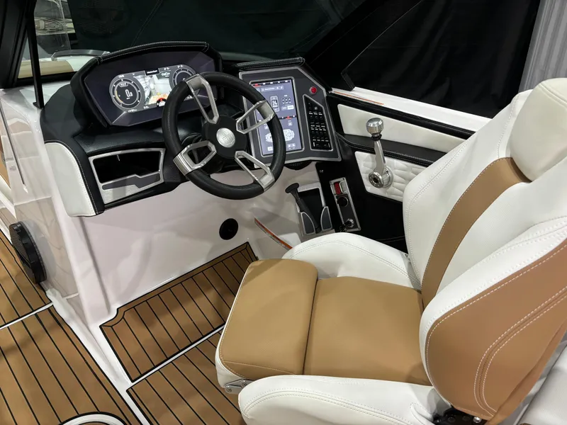 Slide: The Image of 2024 MasterCraft X24 boat interior with modern dashboard and luxurious seating. - 12
