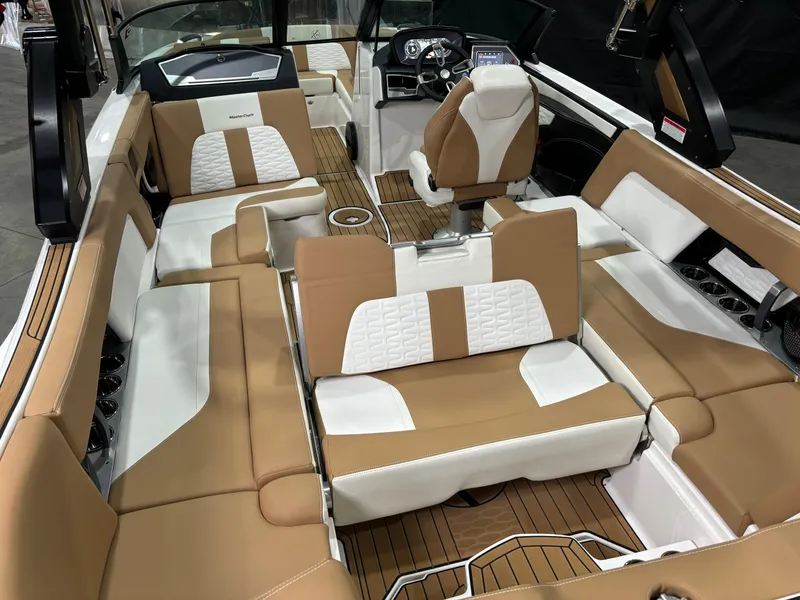 Slide: The Image of 2024 MasterCraft X24 boat interior with tan and white seating, featuring a modern design. - 6