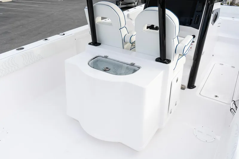 Slide: The Image of 2025 Twin Vee 280 GFX2 CC boat interior with seating and storage. - 11