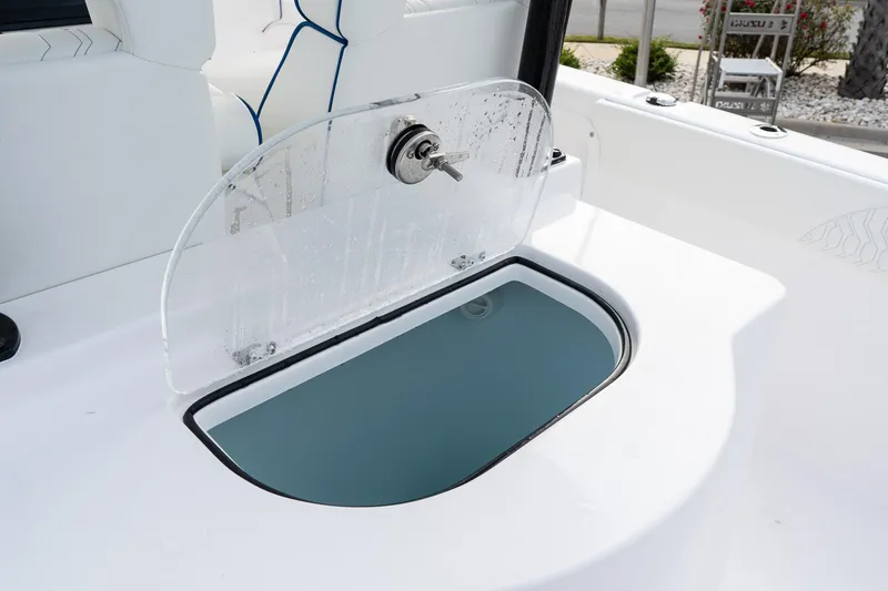 Slide: The Image of 2025 Twin Vee 280 GFX2 CC boat compartment with transparent lid and lock. - 12