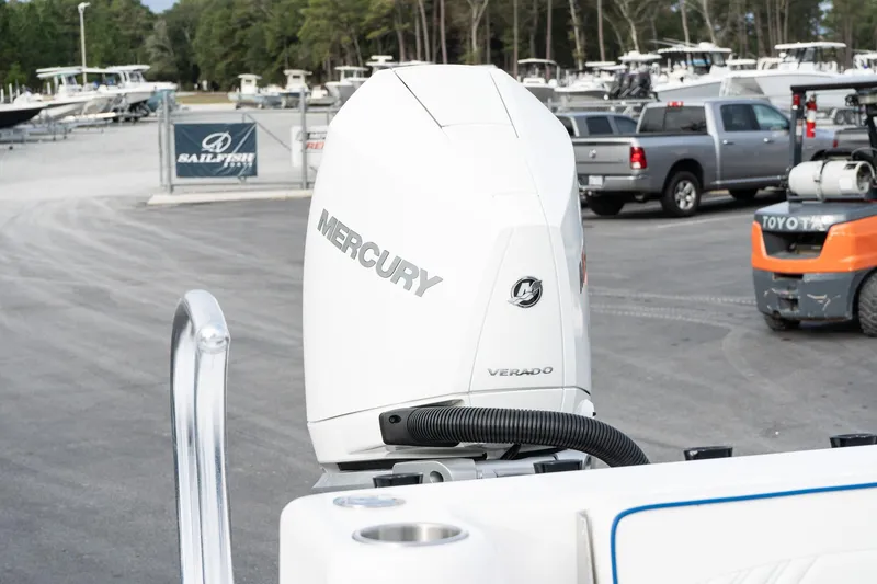 Slide: The Image of 2025 Twin Vee 280 GFX2 CC with Mercury Verado outboard engine in a marina setting. - 14