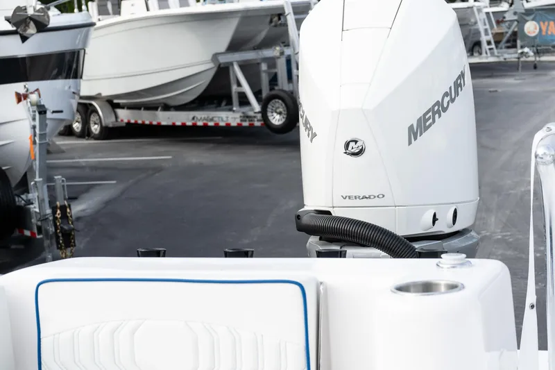 Slide: The Image of 2025 Twin Vee 280 GFX2 CC with Mercury Verado engine in a marina setting. - 16