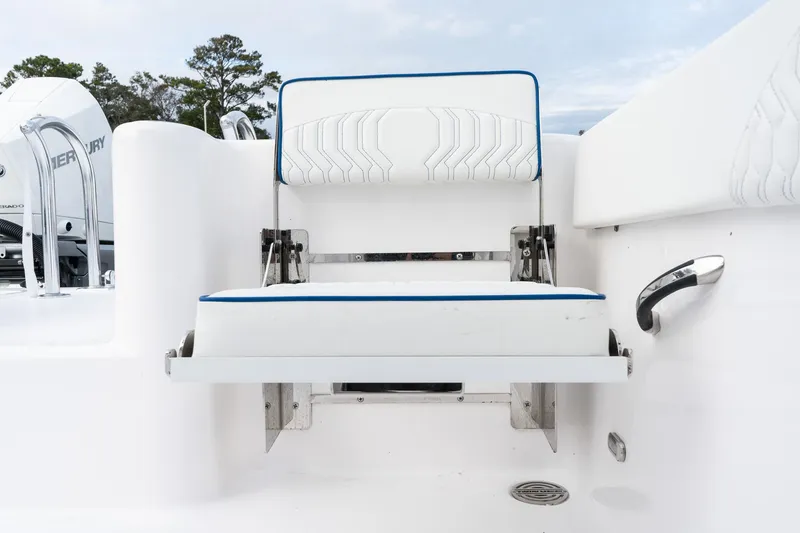 Slide: The Image of Twin Vee 280 GFX2 CC 2025 boat seat with white upholstery and blue trim. - 18