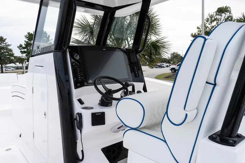 Slide: The Image of 2025 Twin Vee 280 GFX2 CC boat interior with modern helm and seating. - 23
