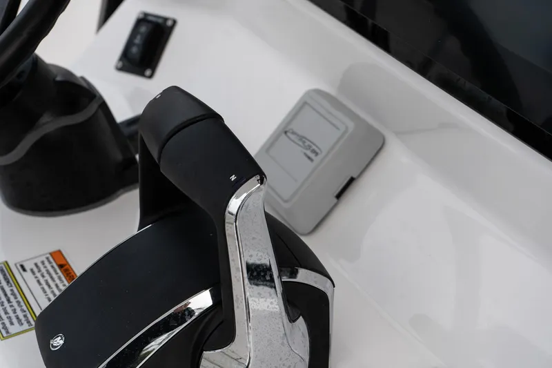 Slide: The Image of Close-up of 2025 Twin Vee 280 GFX2 CC boat controls and dashboard. - 29