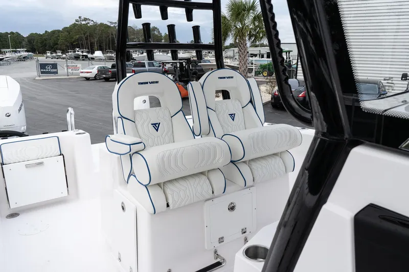Slide: The Image of 2025 Twin Vee 280 GFX2 CC boat interior with plush seating and modern design. - 32