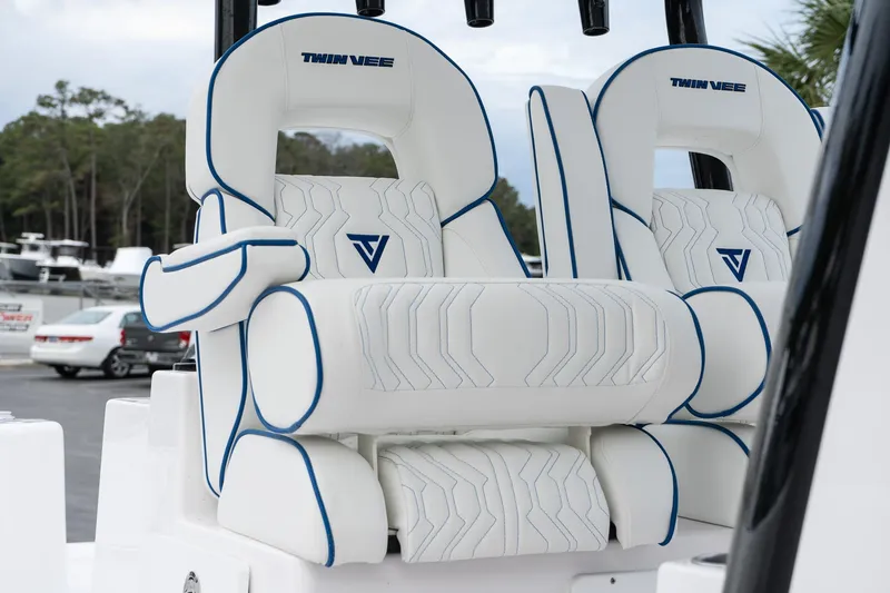 Slide: The Image of 2025 Twin Vee 280 GFX2 CC boat seats with white and blue design. - 33