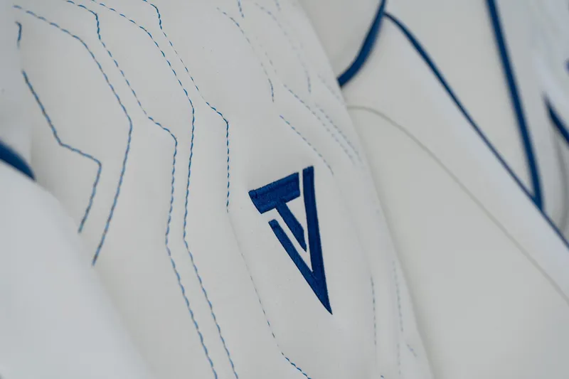 Slide: The Image of Close-up of 2025 Twin Vee 280 GFX2 CC logo on white stitched upholstery. - 36