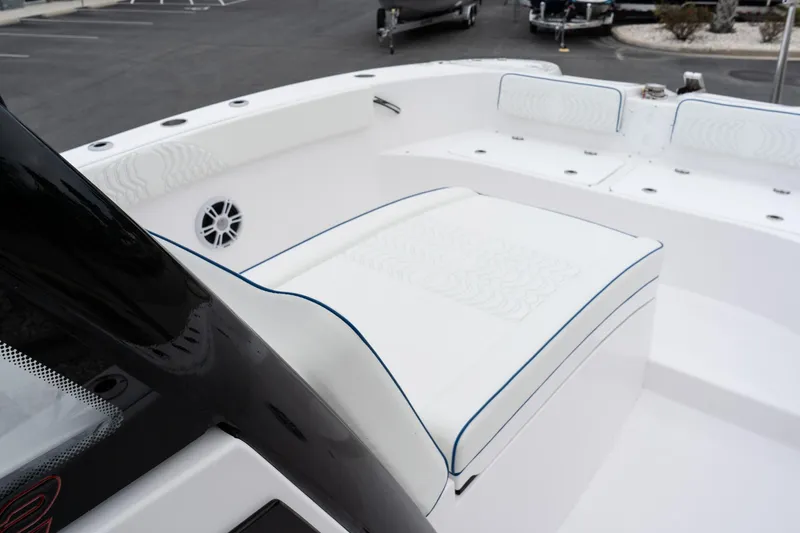 Slide: The Image of 2025 Twin Vee 280 GFX2 CC boat interior with white seating and speaker. - 39