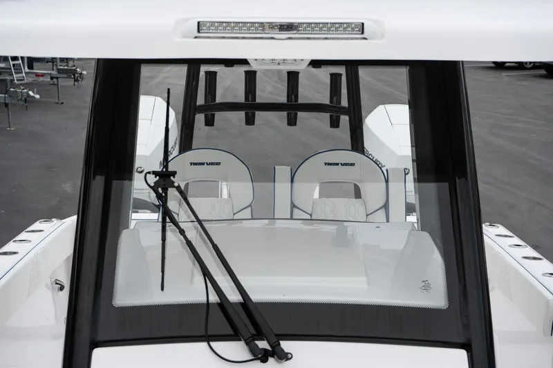 Slide: The Image of 2025 Twin Vee 280 GFX2 CC boat windshield and seating detail. - 44