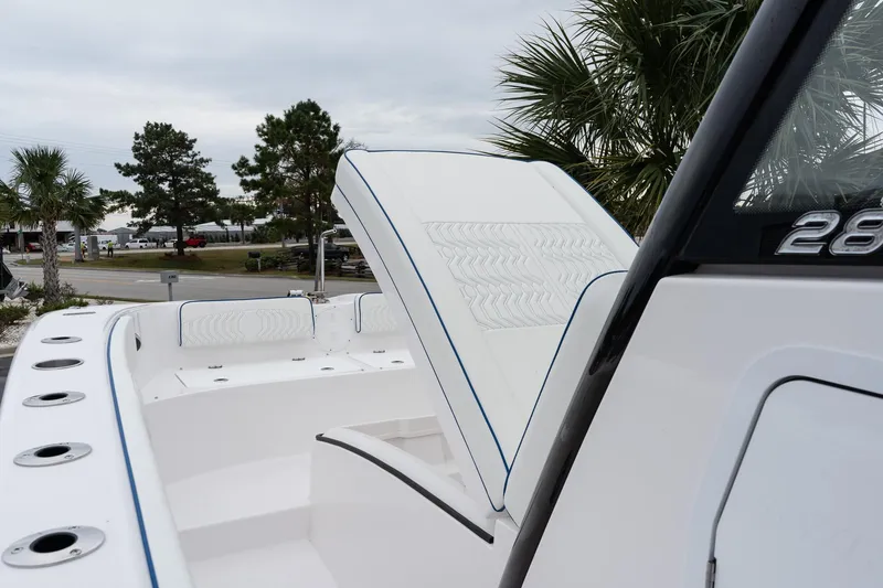 Slide: The Image of 2025 Twin Vee 280 GFX2 CC boat interior with open storage compartment. - 45