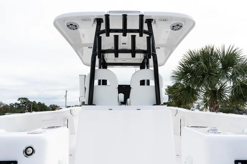 Slide: The Image of 2025 Twin Vee 280 GFX2 CC boat, sleek design, white interior, palm tree background. - 9