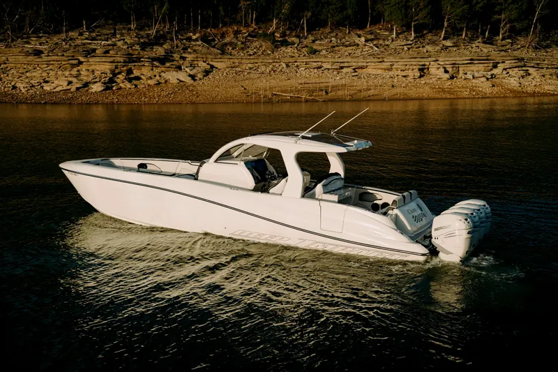 Slide: The Image of 2021 Deep Impact 399 Sport boat cruising on a calm lake. - 0
