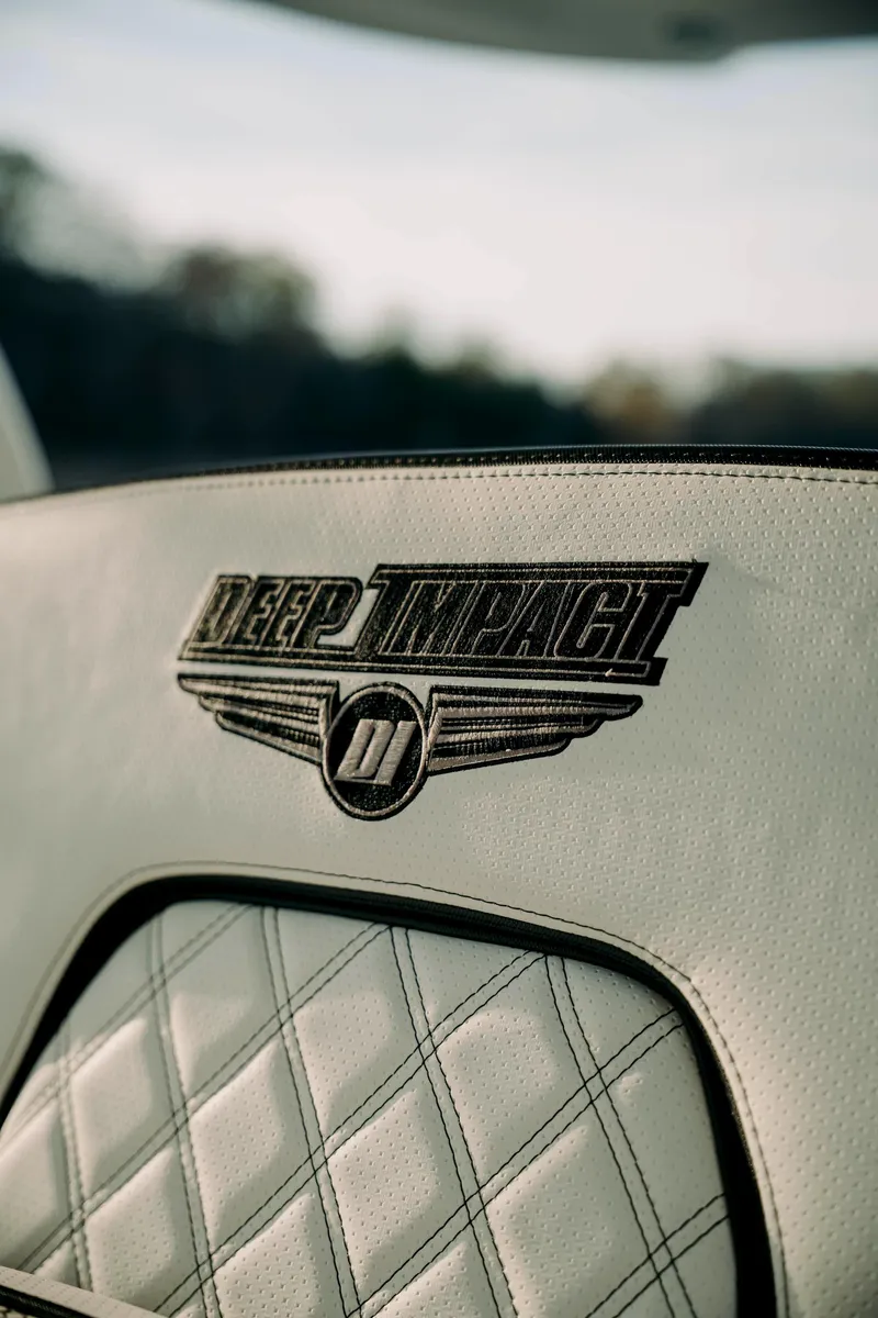 Slide: The Image of 2021 Deep Impact 399 Sport interior with logo on quilted leather seat. - 12