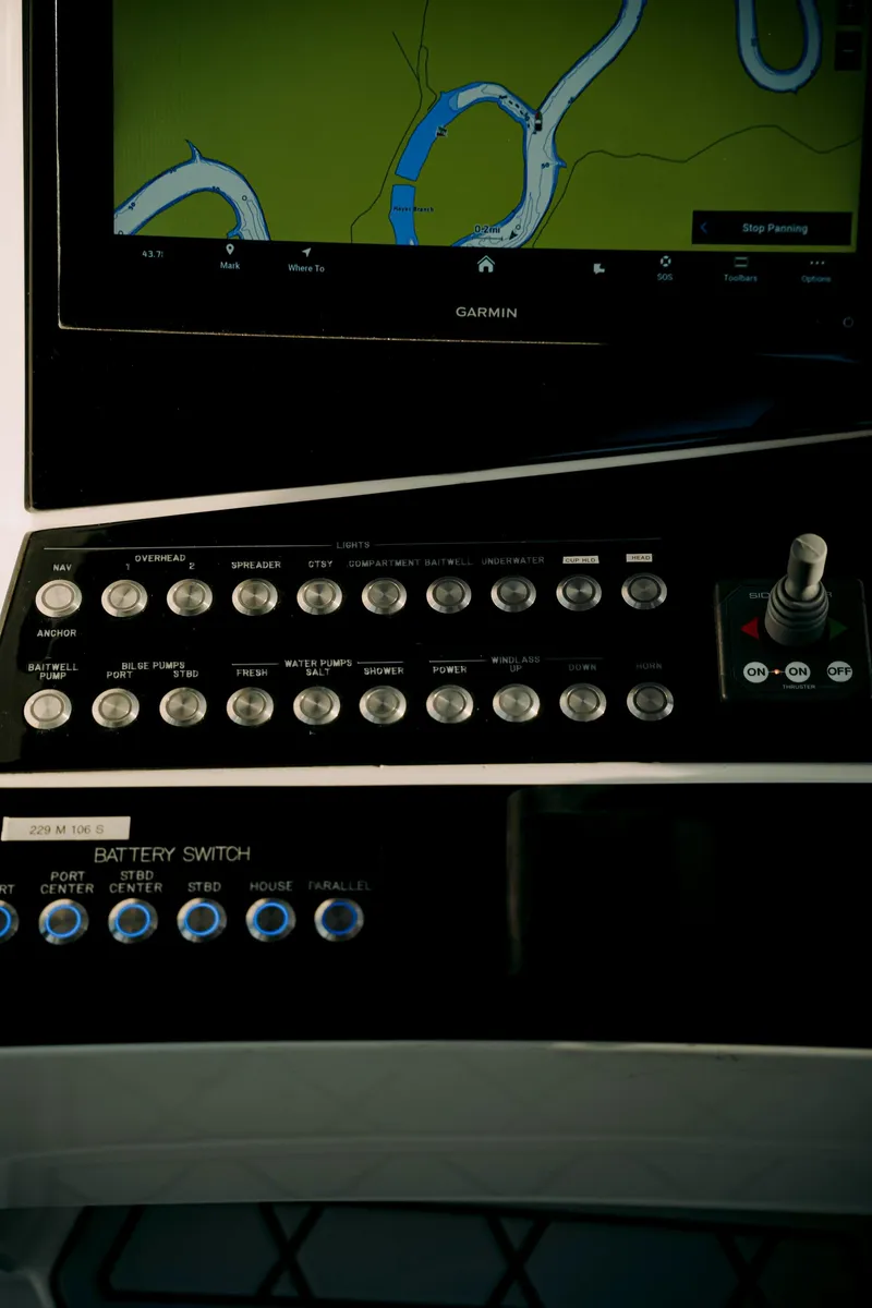 Slide: The Image of Control panel of 2021 Deep Impact 399 Sport boat with navigation screen. - 16