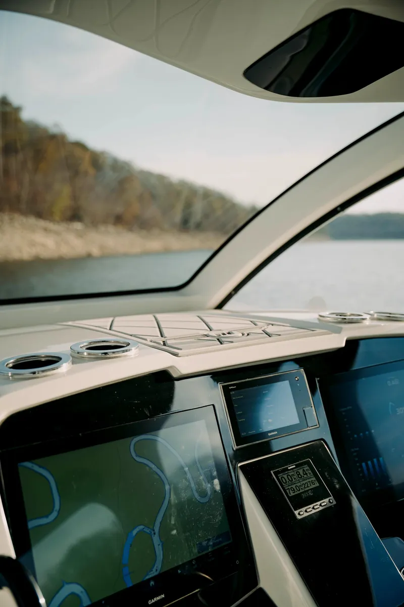 Slide: The Image of Interior view of 2021 Deep Impact 399 Sport boat with navigation screens. - 17