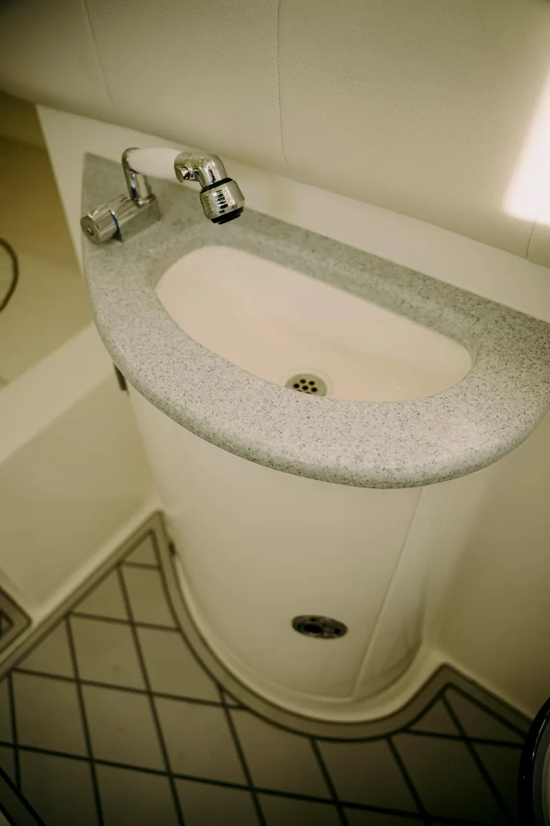 Slide: The Image of Compact sink in 2021 Deep Impact 399 Sport boat bathroom. - 18