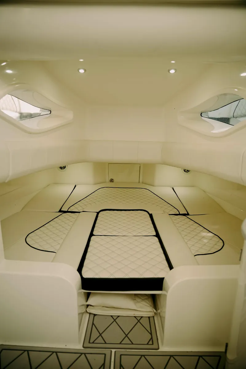 Slide: The Image of Interior cabin of 2021 Deep Impact 399 Sport boat, featuring sleek design and comfortable seating. - 19