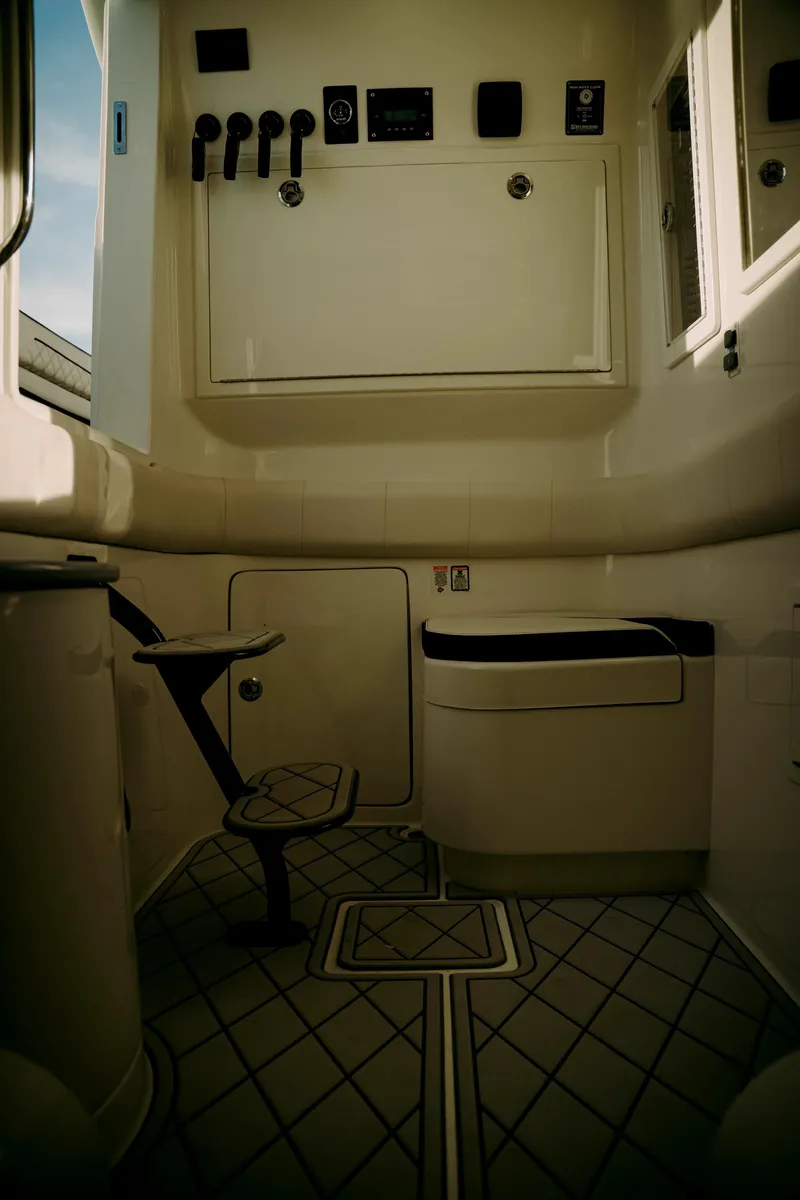 Slide: The Image of Interior of 2021 Deep Impact 399 Sport boat, featuring modern controls and seating. - 21