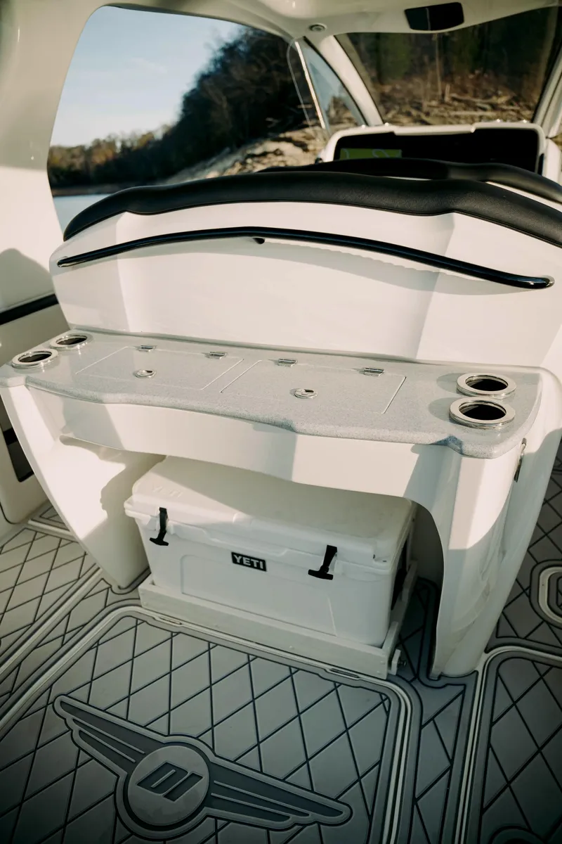 Slide: The Image of 2021 Deep Impact 399 Sport boat interior with seating and storage. - 22