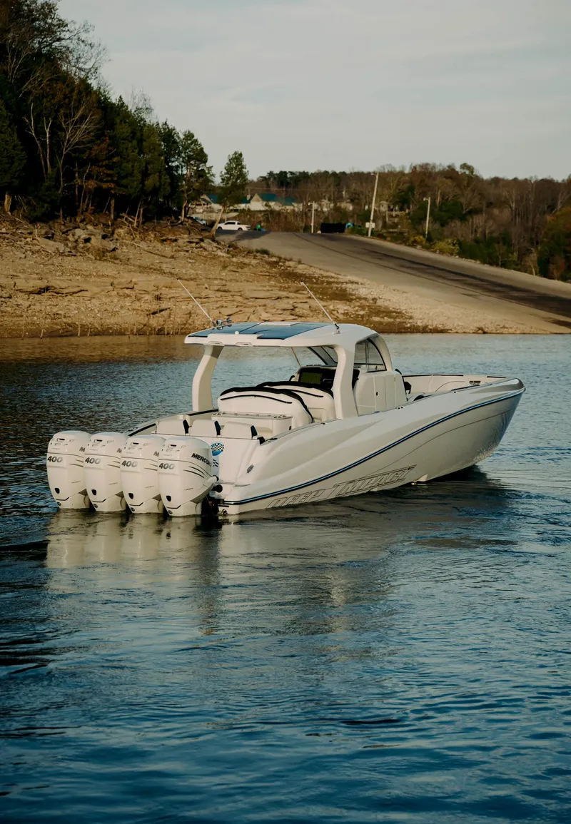 Slide: The Image of 2021 Deep Impact 399 Sport boat cruising on a calm lake. - 5