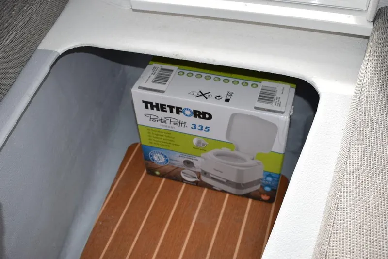 Slide: The Image of Thetford Porta Potti 335 in 2025 Steiger Craft 23 Miami boat storage. - 11