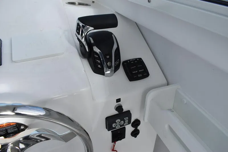 Slide: The Image of 2025 Steiger Craft 23 Miami boat controls and dashboard detail. - 14