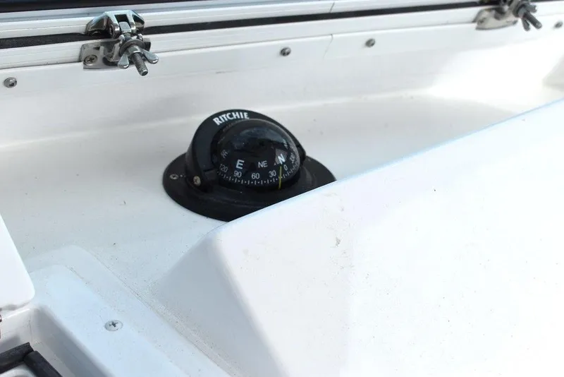 Slide: The Image of Ritchie compass on 2025 Steiger Craft 23 Miami boat dashboard. - 15