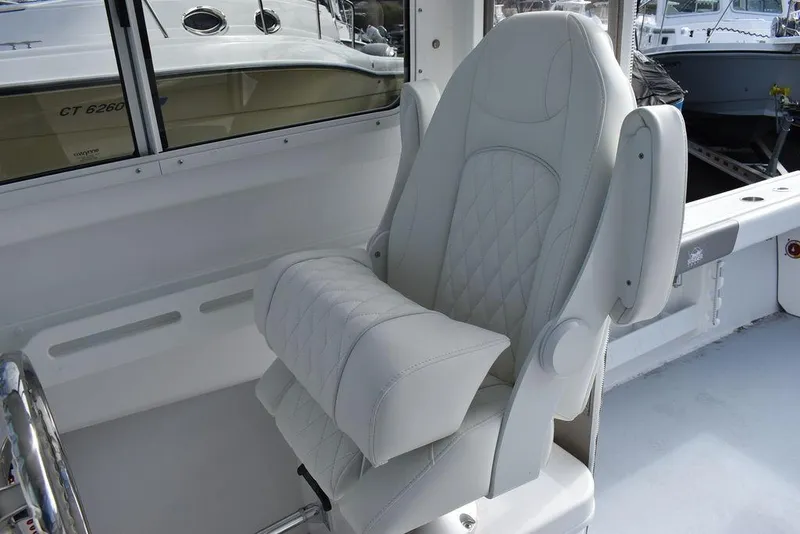 Slide: The Image of 2025 Steiger Craft 23 Miami boat interior with luxurious captain's chair. - 18