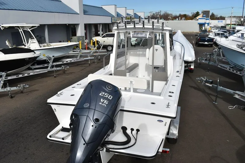 Slide: The Image of 2025 Steiger Craft 23 Miami boat with Yamaha 250 V6 engine in a marina. - 5