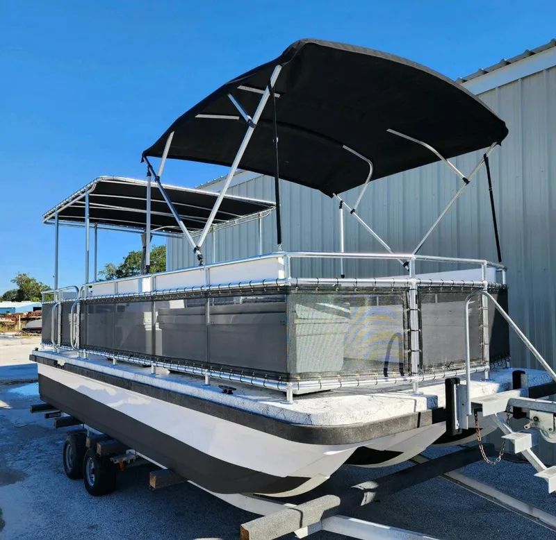 Slide: The Image of 2025 A&M Manufacturing Salty 23 pontoon boat with canopy on trailer. - 10