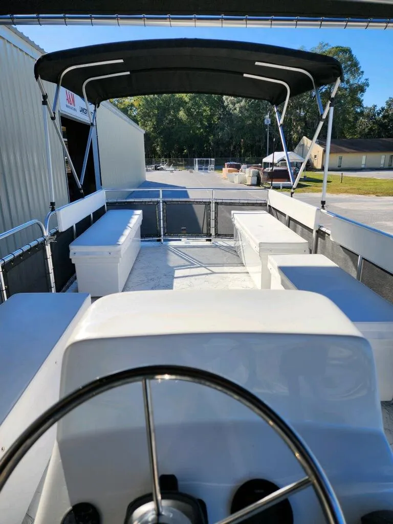 Slide: The Image of 2025 A&M Manufacturing Salty 23 boat interior with canopy and seating. - 15