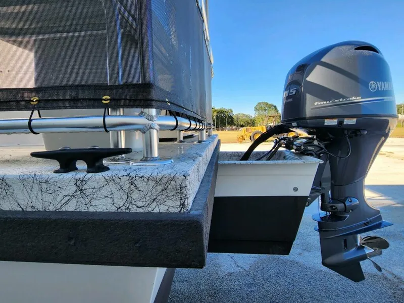 Slide: The Image of 2025 A&M Manufacturing Salty 23 boat with Yamaha outboard motor. - 2