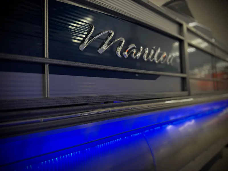 Slide: The Image of 2025 Manitou 23 LX RFXW pontoon boat with blue LED lighting. - 31