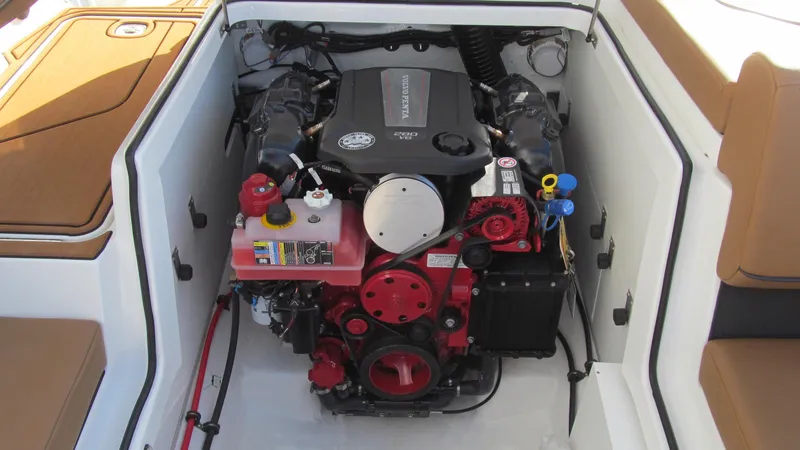 Slide: The Image of 2025 Cobalt CS23 boat engine compartment with detailed view of engine components. - 18