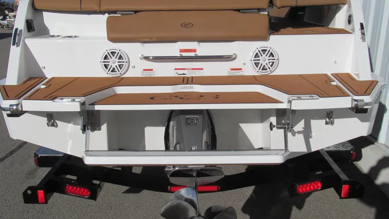 Slide: The Image of 2025 Cobalt CS23 boat stern with speakers and swim platform. - 5